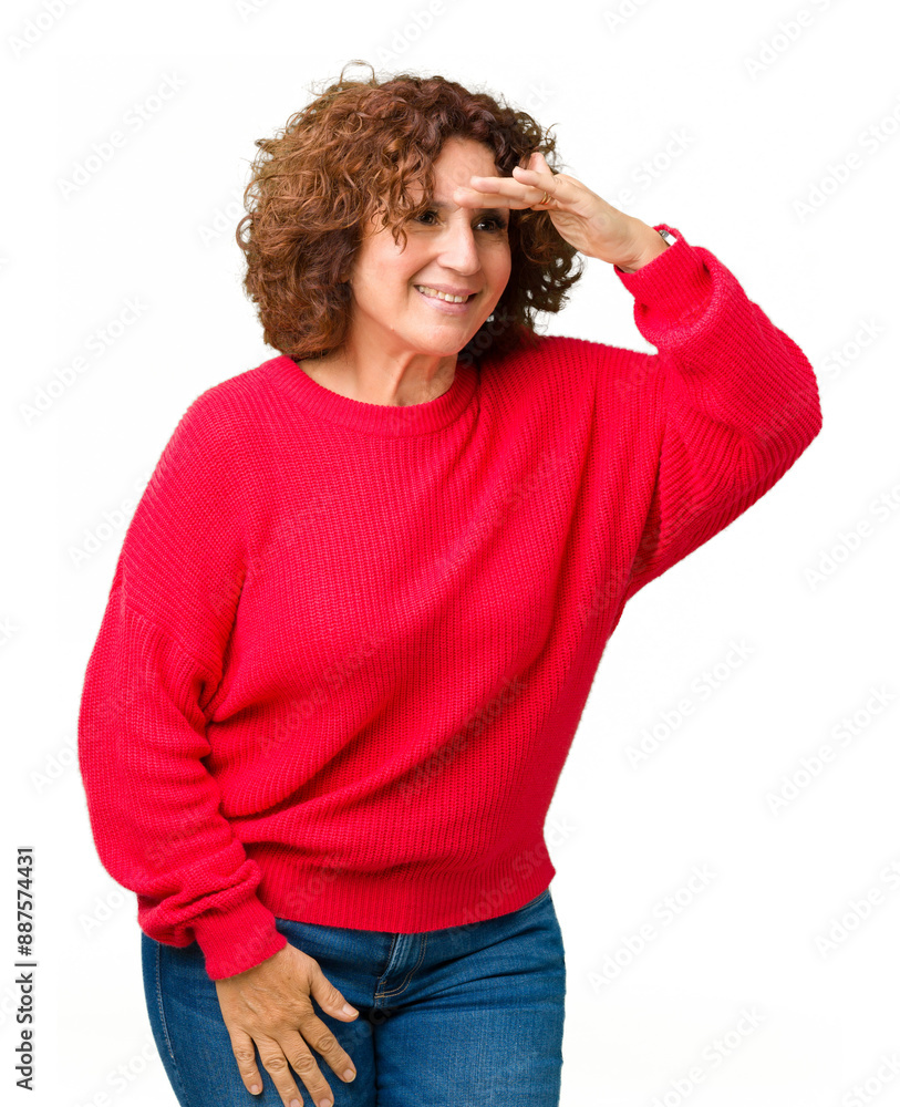 Beautiful middle ager senior woman red winter sweater over isolated background very happy and smiling looking far away with hand over head. Searching concept. Beautiful middle ager senior woman red winter sweater over isolated background very happy and smiling looking far away with hand over head. Searching concept.