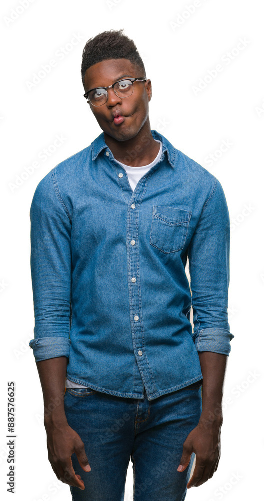 Young african american man over isolated background making fish face with lips, crazy and comical gesture. Funny expression. Young african american man over isolated background making fish face with lips, crazy and comical gesture. Funny expression.