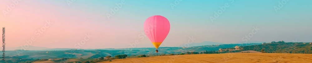 Fototapeta premium Dreamy Sunrise Adventure Hot Air Balloon Floating Above a Serene Landscape, Embodying Aspirations and Minimalism
