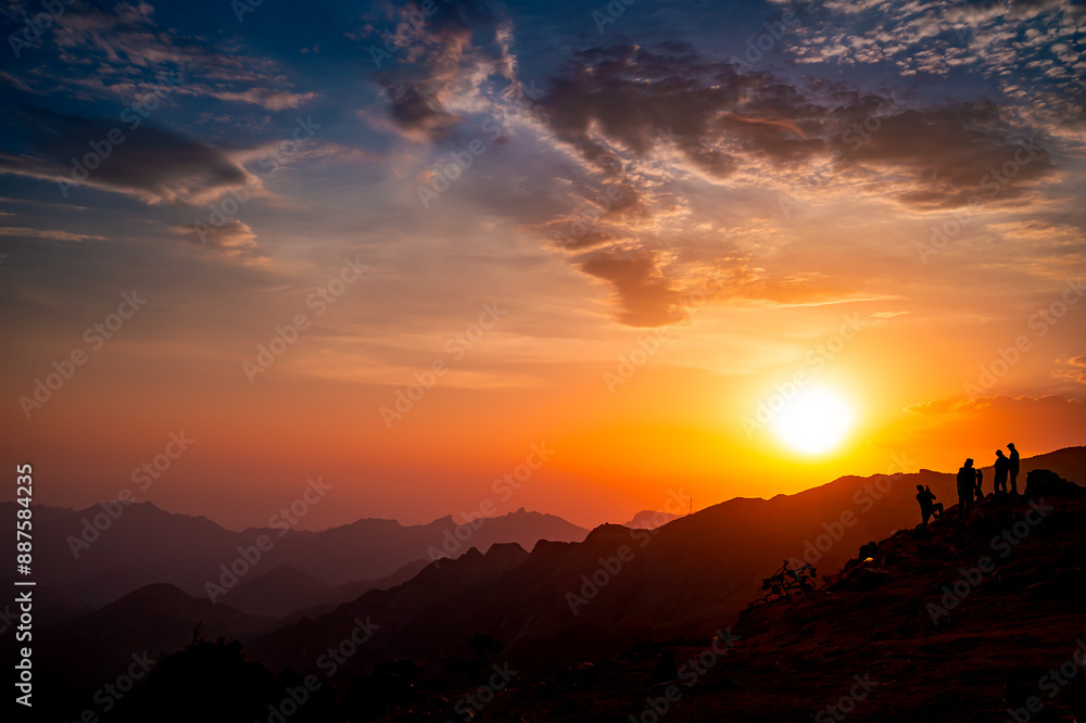 Fototapeta premium Silhouette people on mountain against sky during sunset from As Safa, Taif, Saudi Arabia