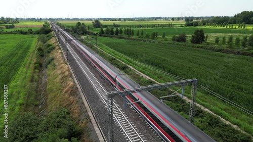 Europe, Italy , Milan - Frecciarossa Hight speed 300km h train raylway from Milano  to Rome view from the drone - the faster way to travel in Italy for tourist and passengers - tourist destination  photo