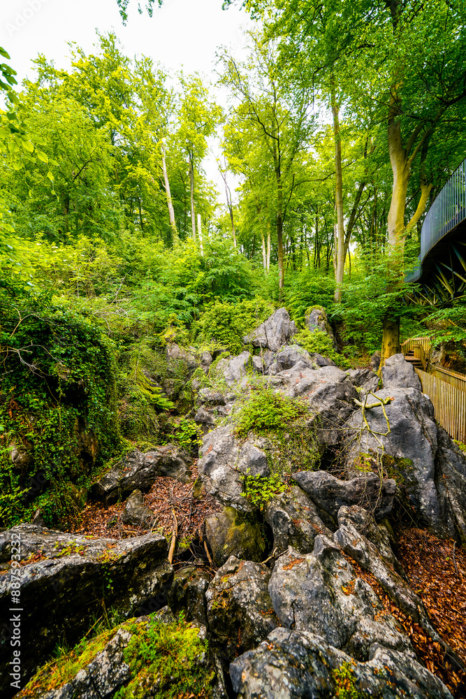 Obraz premium Path through nature at the Felsenmeer in Hemer. Forested biotope with rocks in the Sauerland. 