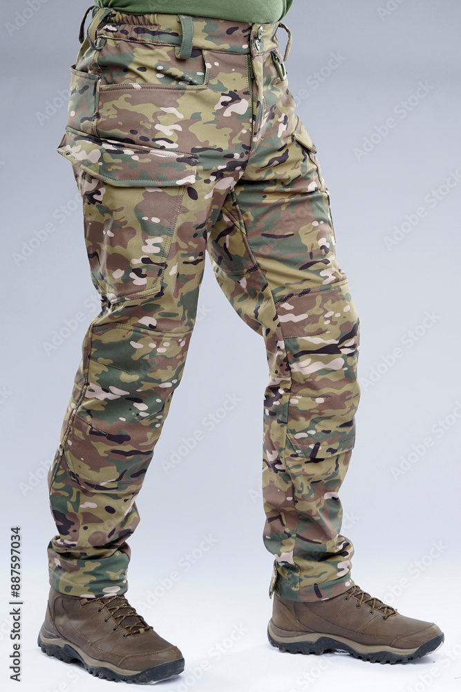 Tactical clothing. Close up of pants and shoes Tactical clothing. Close up of pants and shoes