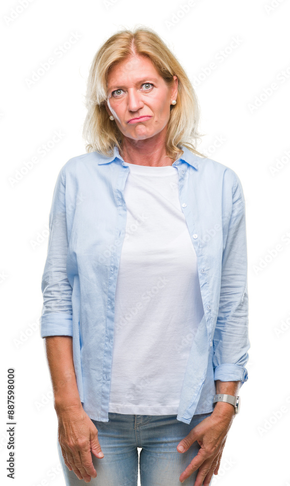 Middle age blonde woman over isolated background depressed and worry for distress, crying angry and afraid. Sad expression. Middle age blonde woman over isolated background depressed and worry for distress, crying angry and afraid. Sad expression.