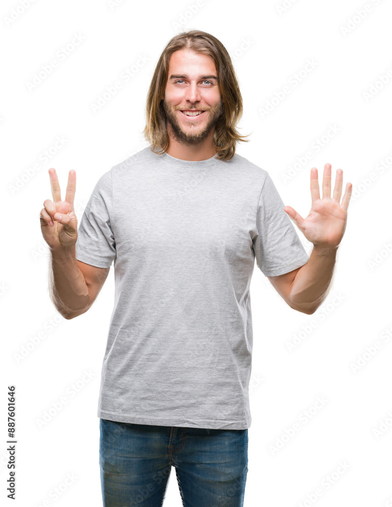 Young handsome man with long hair over isolated background showing and pointing up with fingers number seven while smiling confident and happy. Young handsome man with long hair over isolated background showing and pointing up with fingers number seven while smiling confident and happy.
