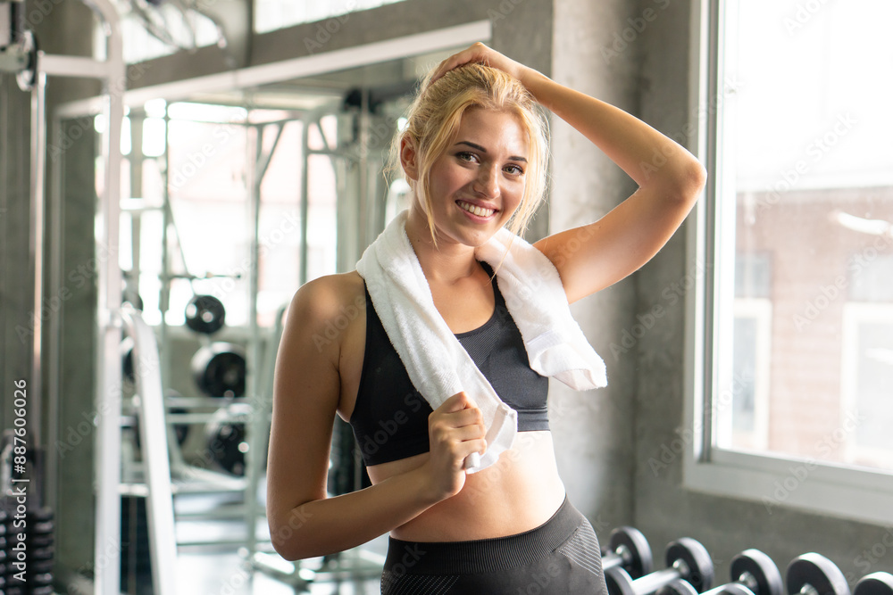 Cheerful girl smiling in gym feel fresh after exercise. Cheerful girl smiling in gym feel fresh after exercise.