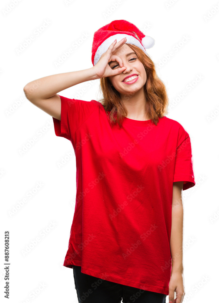 Young beautiful woman over isolated background wearing christmas hat doing ok gesture with hand smiling, eye looking through fingers with happy face. Young beautiful woman over isolated background wearing christmas hat doing ok gesture with hand smiling, eye looking through fingers with happy face.