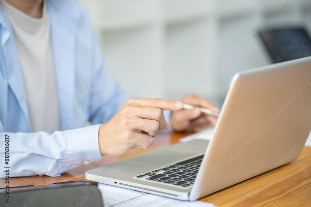 Business man working by using laptop computer Hands typing on a keyboard. Professional investor working new start up project. business planning in office. Technology business Concept. Business man working by using laptop computer Hands typing on a keyboard. Professional investor working new start up project. business planning in office. Technology business Concept.