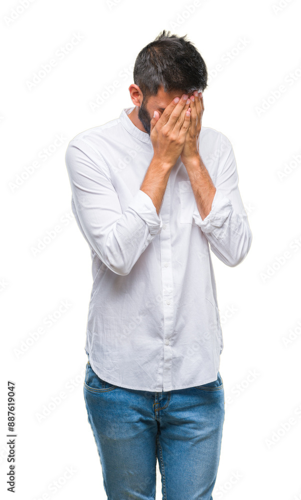 Adult hispanic man over isolated background with sad expression covering face with hands while crying. Depression concept. Adult hispanic man over isolated background with sad expression covering face with hands while crying. Depression concept.