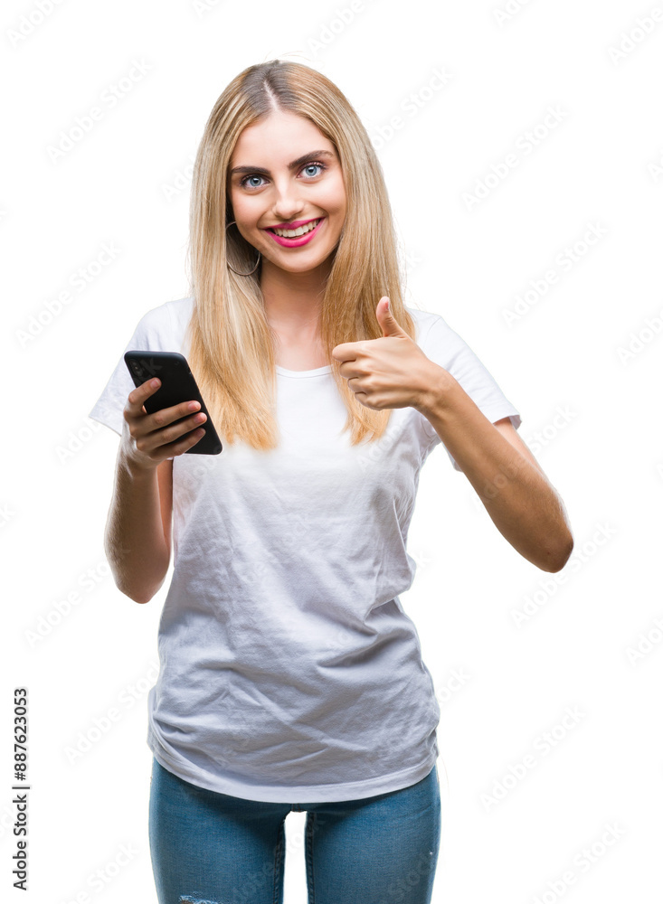 Young beautiful blonde woman using smartphone over isolated background happy with big smile doing ok sign, thumb up with fingers, excellent sign Young beautiful blonde woman using smartphone over isolated background happy with big smile doing ok sign, thumb up with fingers, excellent sign