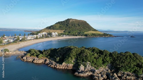 Moturiki Island Off Mount Maunganui Beach In Tauranga, North Island, New Zealand. aerial pullback shot photo