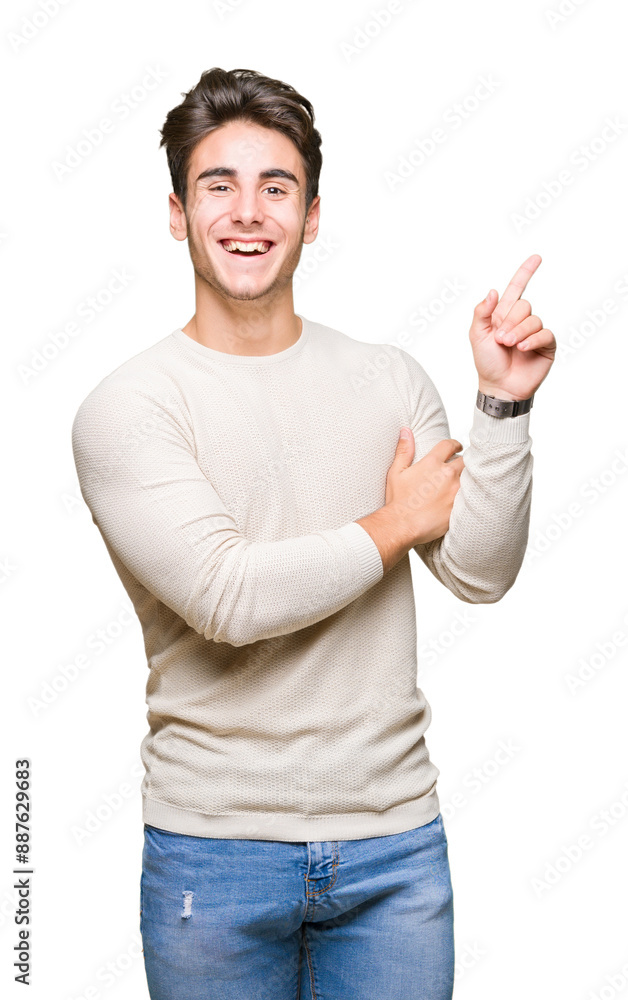 Young handsome man over isolated background with a big smile on face, pointing with hand and finger to the side looking at the camera. Young handsome man over isolated background with a big smile on face, pointing with hand and finger to the side looking at the camera.