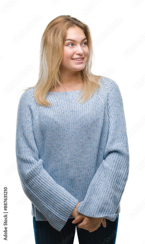 Young caucasian woman wearing winter sweater over isolated background looking away to side with smile on face, natural expression. Laughing confident. Young caucasian woman wearing winter sweater over isolated background looking away to side with smile on face, natural expression. Laughing confident.