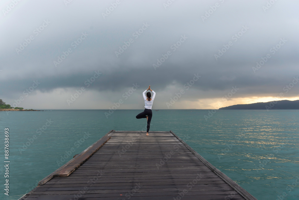 Young healthy woman practicing yoga on the bridge in the nature Young healthy woman practicing yoga on the bridge in the nature