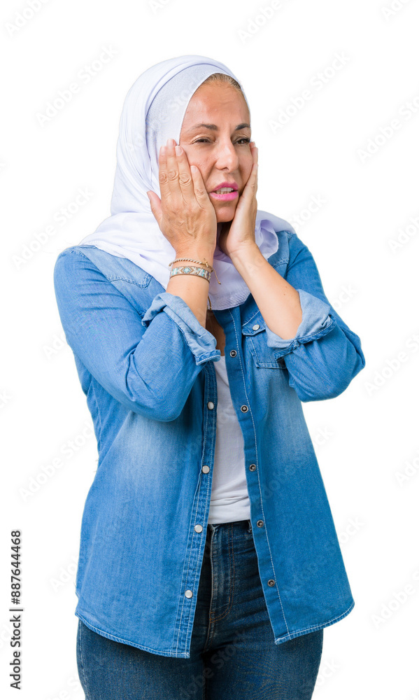 Middle age eastern arab woman wearing arabian hijab over isolated background Tired hands covering face, depression and sadness, upset and irritated for problem Middle age eastern arab woman wearing arabian hijab over isolated background Tired hands covering face, depression and sadness, upset and irritated for problem