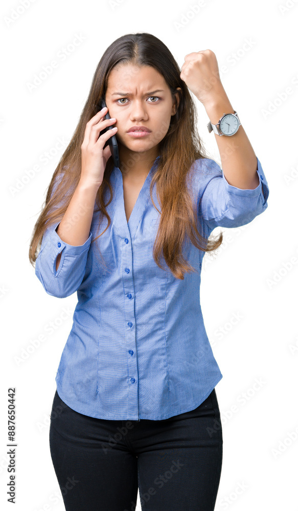 Young beautiful brunette business woman talking on smartphone over isolated background annoyed and frustrated shouting with anger, crazy and yelling with raised hand, anger concept Young beautiful brunette business woman talking on smartphone over isolated background annoyed and frustrated shouting with anger, crazy and yelling with raised hand, anger concept
