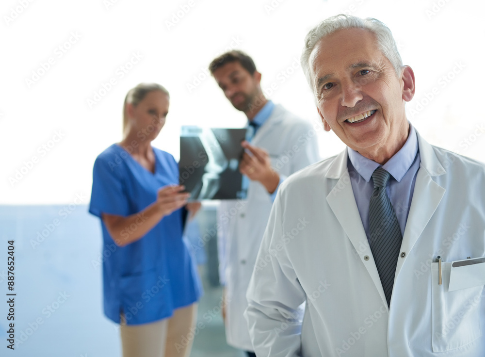 Portrait, doctor or mature man with leadership in cancer, osteoporosis or arthritis research in office. Smile, confidence and medical professional with team management, xray and healthcare support Portrait, doctor or mature man with leadership in cancer, osteoporosis or arthritis research in office. Smile, confidence and medical professional with team management, xray and healthcare support