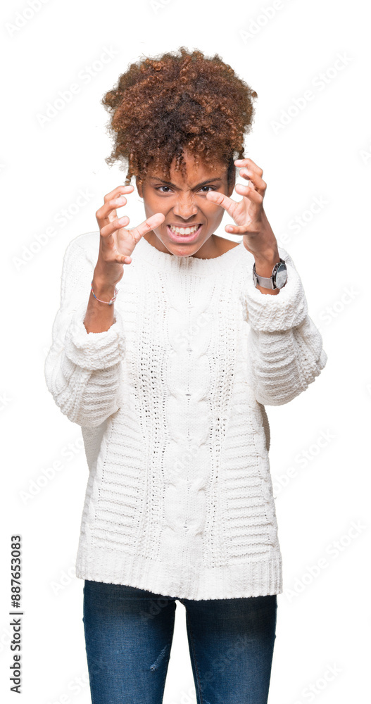 Beautiful young african american woman wearing winter sweater over isolated background Shouting frustrated with rage, hands trying to strangle, yelling mad Beautiful young african american woman wearing winter sweater over isolated background Shouting frustrated with rage, hands trying to strangle, yelling mad