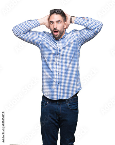 Young handsome man over isolated background Crazy and scared with hands on head, afraid and surprised of shock with open mouth