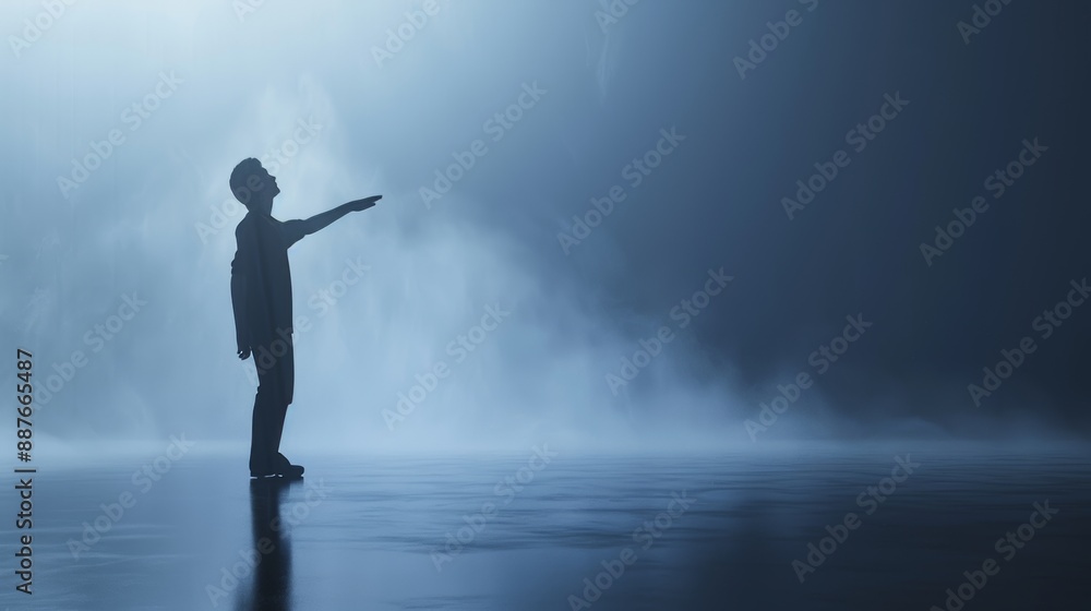 The silhouette of a human, a man, pointing up with a left hand on a blue backdrop, with an arm up. The silhouette of a human, a man, pointing up with a left hand on a blue backdrop, with an arm up.