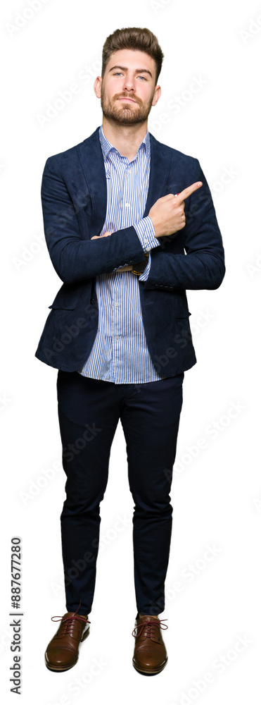 Young handsome bussines man Pointing with hand finger to the side showing advertisement, serious and calm face Young handsome bussines man Pointing with hand finger to the side showing advertisement, serious and calm face