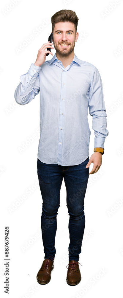 Young handsome man business talking on smartphone with a happy face standing and smiling with a confident smile showing teeth Young handsome man business talking on smartphone with a happy face standing and smiling with a confident smile showing teeth
