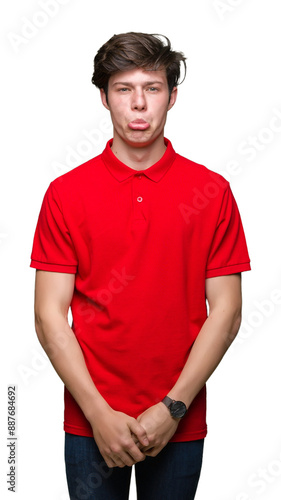 Young handsome man wearing red t-shirt over isolated background depressed and worry for distress, crying angry and afraid. Sad expression.