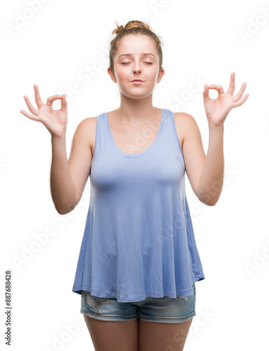 Young blonde woman relax and smiling with eyes closed doing meditation gesture with fingers. Yoga concept.