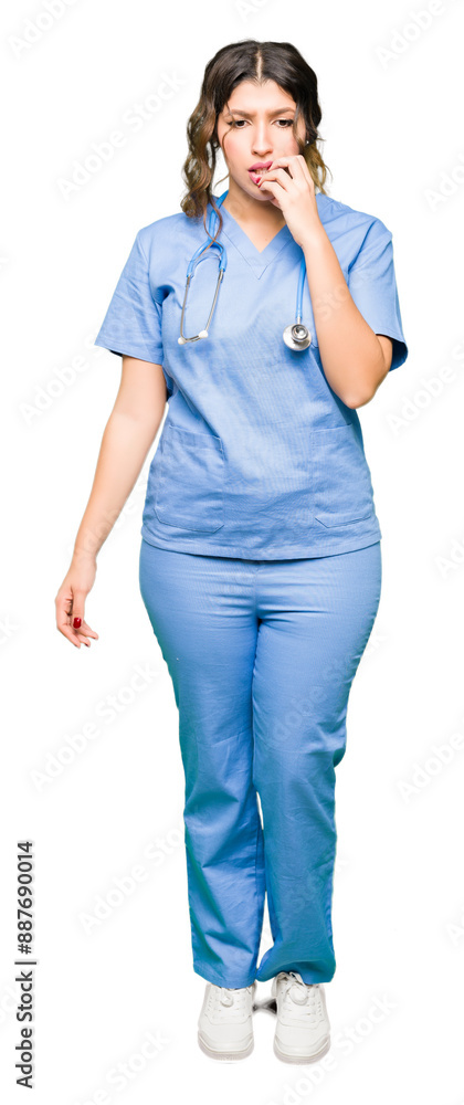 Young adult doctor woman wearing medical uniform looking stressed and nervous with hands on mouth biting nails. Anxiety problem. Young adult doctor woman wearing medical uniform looking stressed and nervous with hands on mouth biting nails. Anxiety problem.