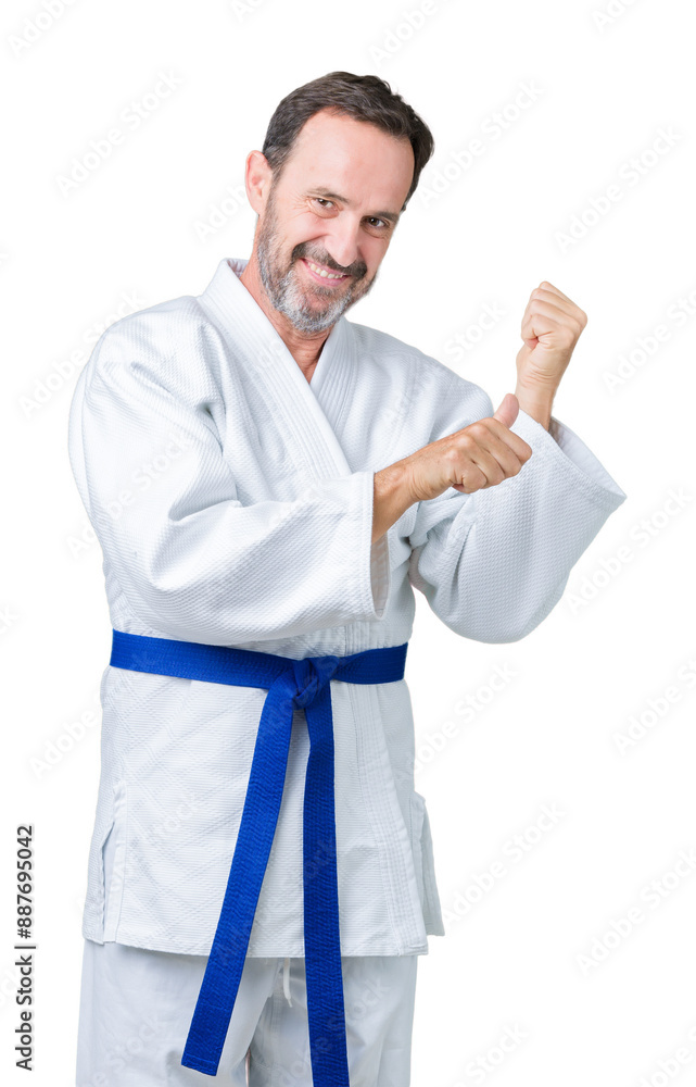 Handsome middle age senior man wearing kimono uniform over isolated background Pointing to the back behind with hand and thumbs up, smiling confident Handsome middle age senior man wearing kimono uniform over isolated background Pointing to the back behind with hand and thumbs up, smiling confident