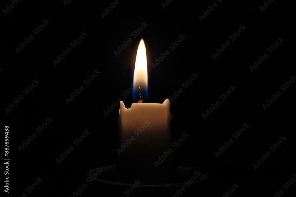 candle light on a black background, close-up of photo candle light on a black background, close-up of photo