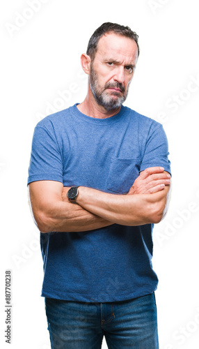 Middle age hoary senior man over isolated background skeptic and nervous, disapproving expression on face with crossed arms. Negative person.