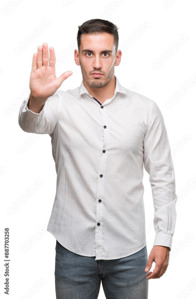 Handsome young business man with open hand doing stop sign with serious and confident expression, defense gesture Handsome young business man with open hand doing stop sign with serious and confident expression, defense gesture