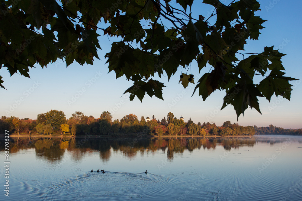 Beautiful landscape in a park in autumn season with lake in background and colourful leafs