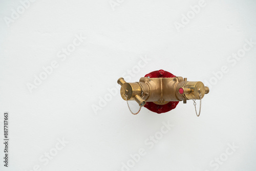 Photography fire hydrant system powerful on the white cement wall