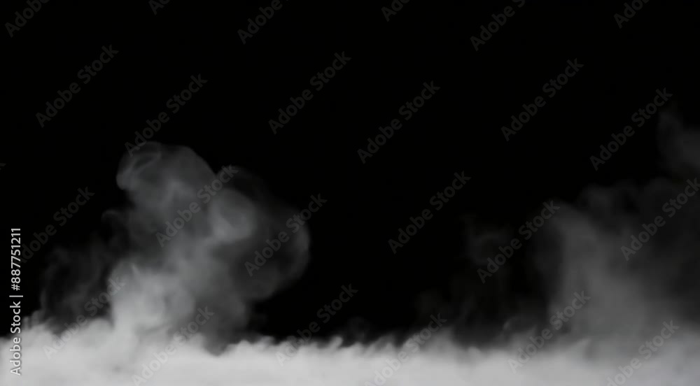 Ground fog swirling smoke rolling low across the ground, isolated on black background Ground fog swirling smoke rolling low across the ground, isolated on black background