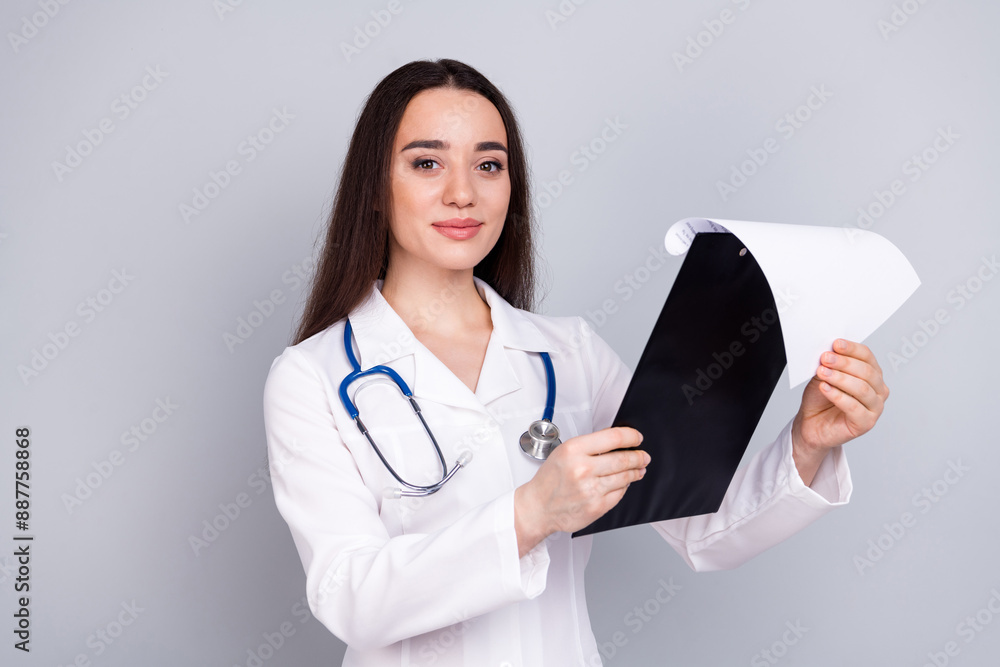 Photo of professional medical worker lady hold clipboard white coat isolated on grey color background