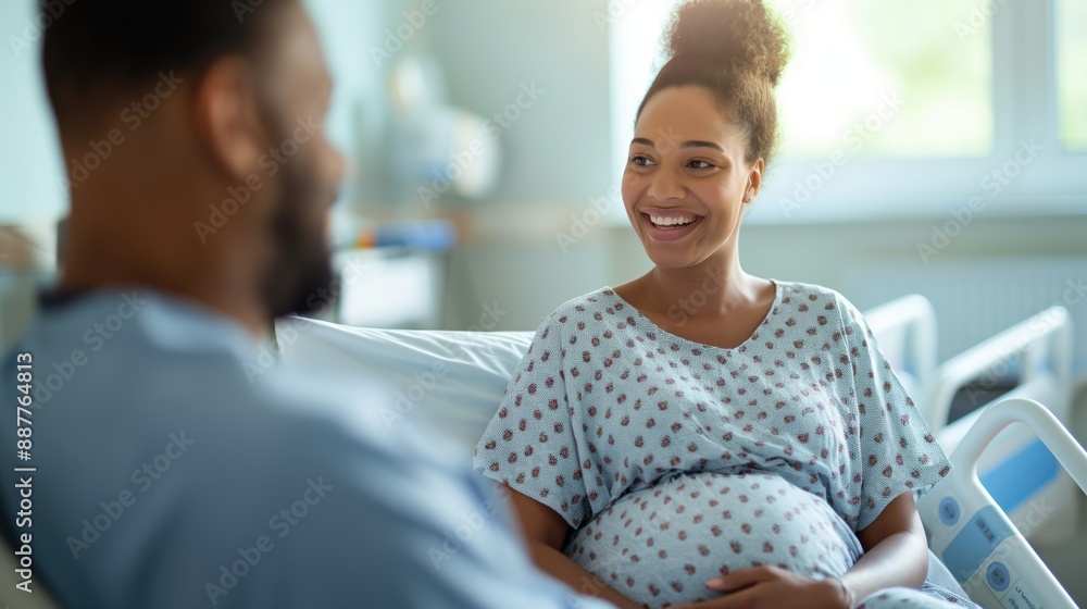Pregnant woman with husband in a hospital room waiting for labor and delivery Pregnant woman with husband in a hospital room waiting for labor and delivery