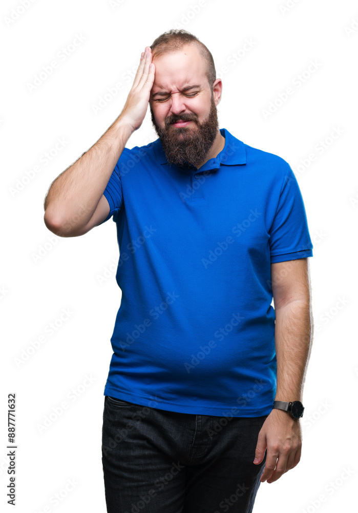 Young caucasian hipster man wearing blue shirt over isolated background suffering from headache desperate and stressed because pain and migraine. Hands on head. Young caucasian hipster man wearing blue shirt over isolated background suffering from headache desperate and stressed because pain and migraine. Hands on head.