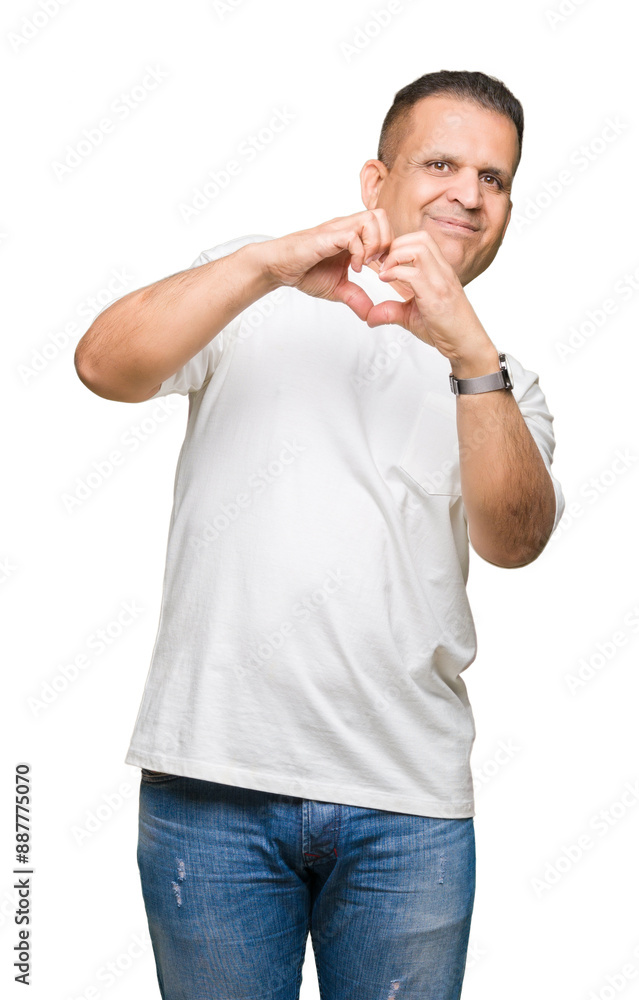 Middle age arab man wearig white t-shirt over isolated background smiling in love showing heart symbol and shape with hands. Romantic concept. Middle age arab man wearig white t-shirt over isolated background smiling in love showing heart symbol and shape with hands. Romantic concept.