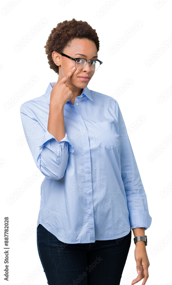 Young beautiful african american business woman over isolated background Pointing to the eye watching you gesture, suspicious expression Young beautiful african american business woman over isolated background Pointing to the eye watching you gesture, suspicious expression