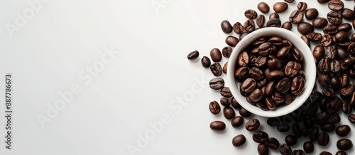 A white cup with coffee bea...