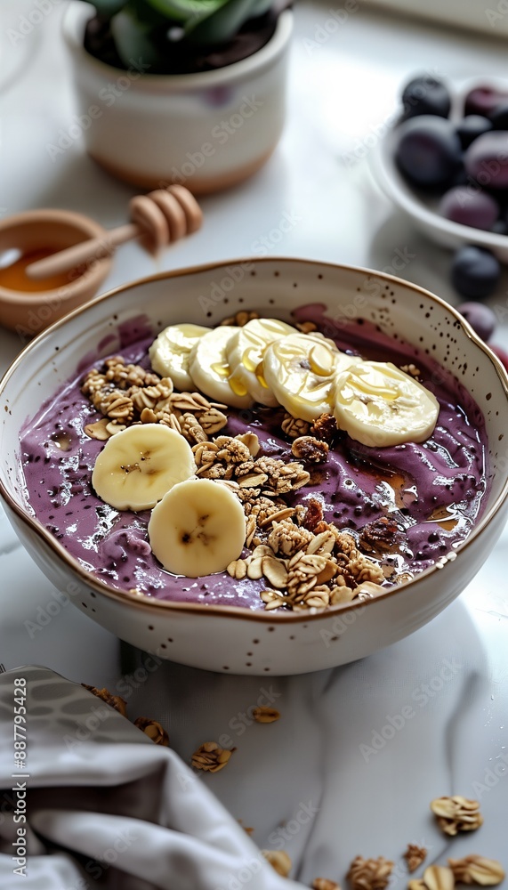 a bowl of oatmeal topped with bananas and granola a bowl of oatmeal topped with bananas and granola
