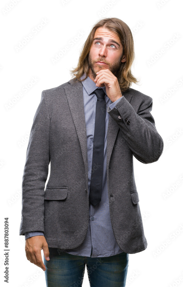Young handsome business man with long hair over isolated background with hand on chin thinking about question, pensive expression. Smiling with thoughtful face. Doubt concept. Young handsome business man with long hair over isolated background with hand on chin thinking about question, pensive expression. Smiling with thoughtful face. Doubt concept.
