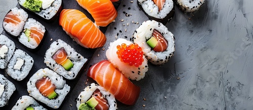 A variety of sushi rolls fe...