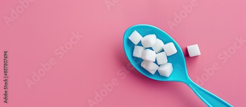 A blue plastic spoon heapin...