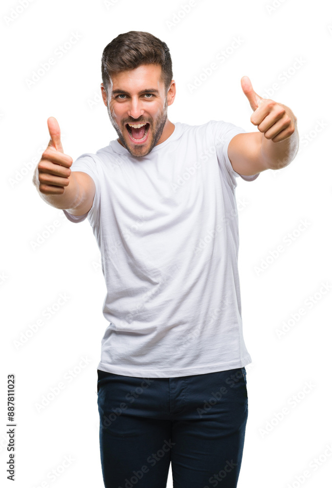 Young handsome man over isolated background approving doing positive gesture with hand, thumbs up smiling and happy for success. Looking at the camera, winner gesture. Young handsome man over isolated background approving doing positive gesture with hand, thumbs up smiling and happy for success. Looking at the camera, winner gesture.