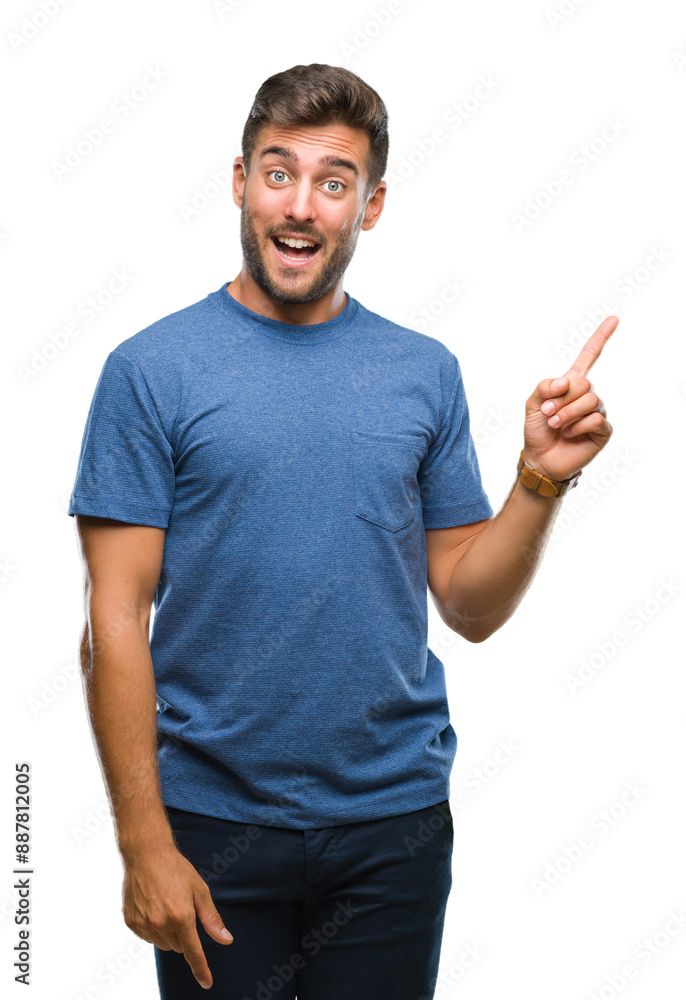 Young handsome man over isolated background with a big smile on face, pointing with hand and finger to the side looking at the camera. Young handsome man over isolated background with a big smile on face, pointing with hand and finger to the side looking at the camera.