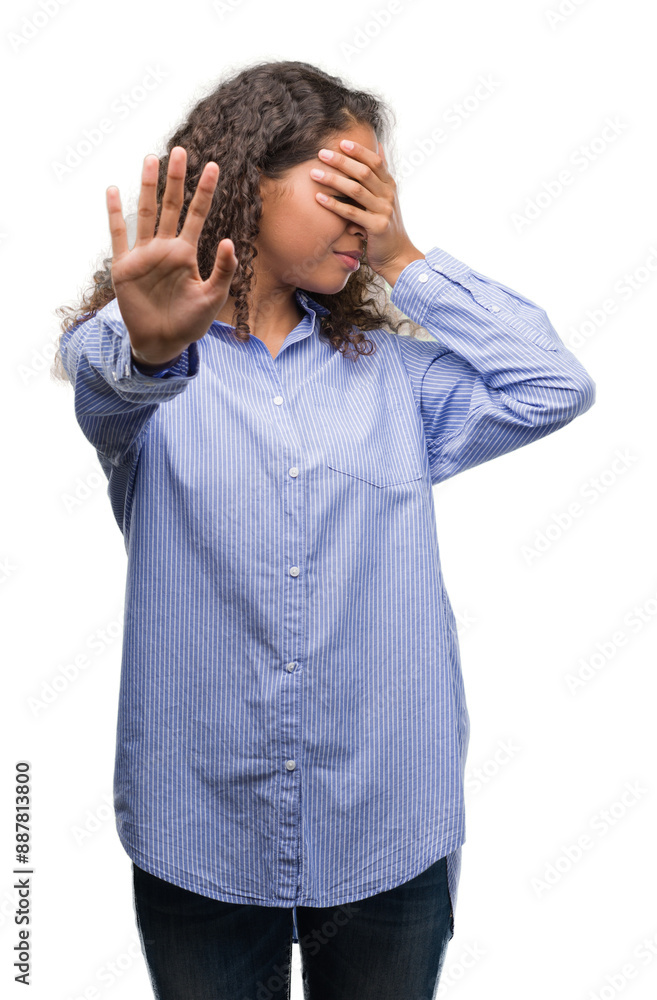 Young hispanic business woman covering eyes with hands and doing stop gesture with sad and fear expression. Embarrassed and negative concept. Young hispanic business woman covering eyes with hands and doing stop gesture with sad and fear expression. Embarrassed and negative concept.