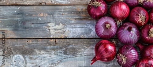 Red Onions on a bright wood...
